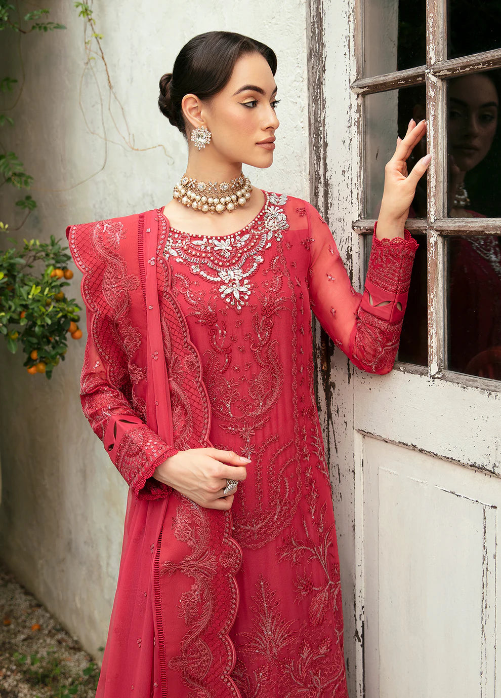 Model in Gulaal Ulmaria embroidered chiffon dress, traditional Pakistani wear in the UK.