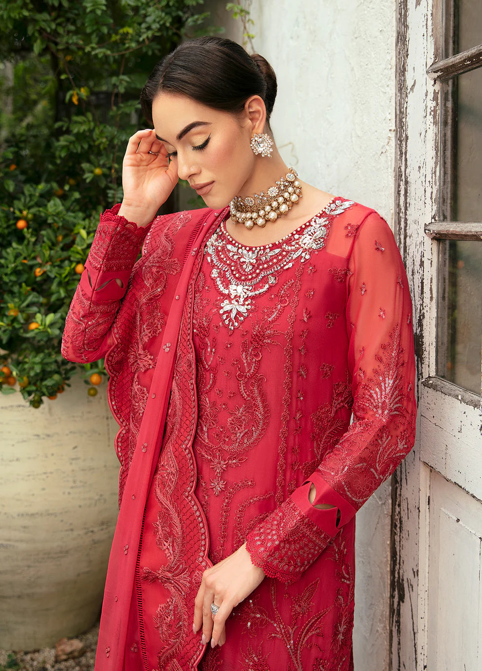 Model in Gulaal Ulmaria embroidered chiffon dress, traditional Pakistani wear in the UK.