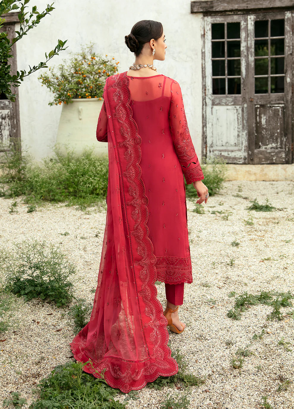 Model in Gulaal Ulmaria embroidered chiffon dress, traditional Pakistani wear in the UK.