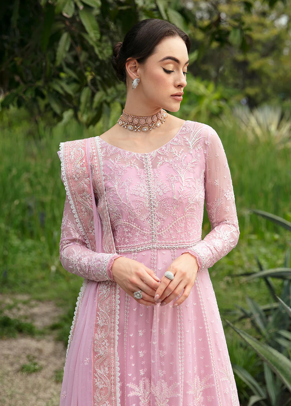 Model wearing Gulaal Amour pink chiffon Eid dress, Suffuse detail, sought - after Pakistani clothes UK.