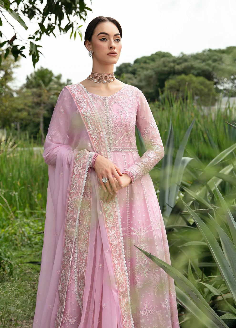 Model wearing Gulaal Amour pink chiffon Eid dress, Suffuse detail, sought - after Pakistani clothes UK.