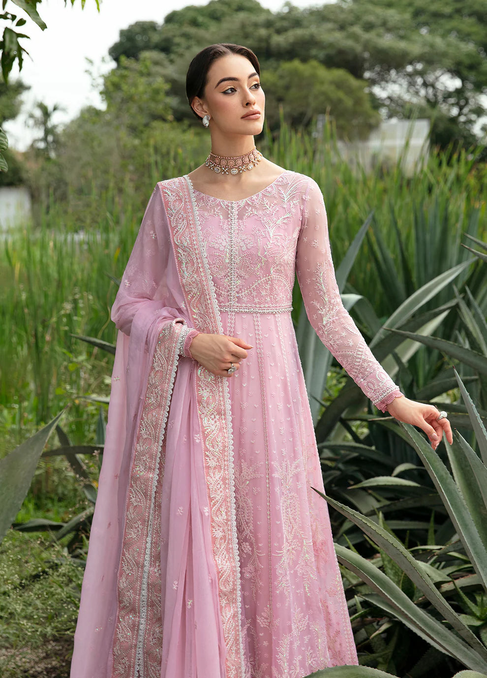 Model wearing Gulaal Amour pink chiffon Eid dress, Suffuse detail, sought - after Pakistani clothes UK.