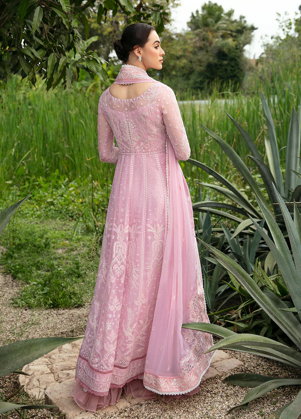 Model wearing Gulaal Amour pink chiffon Eid dress, Suffuse detail, sought - after Pakistani clothes UK.