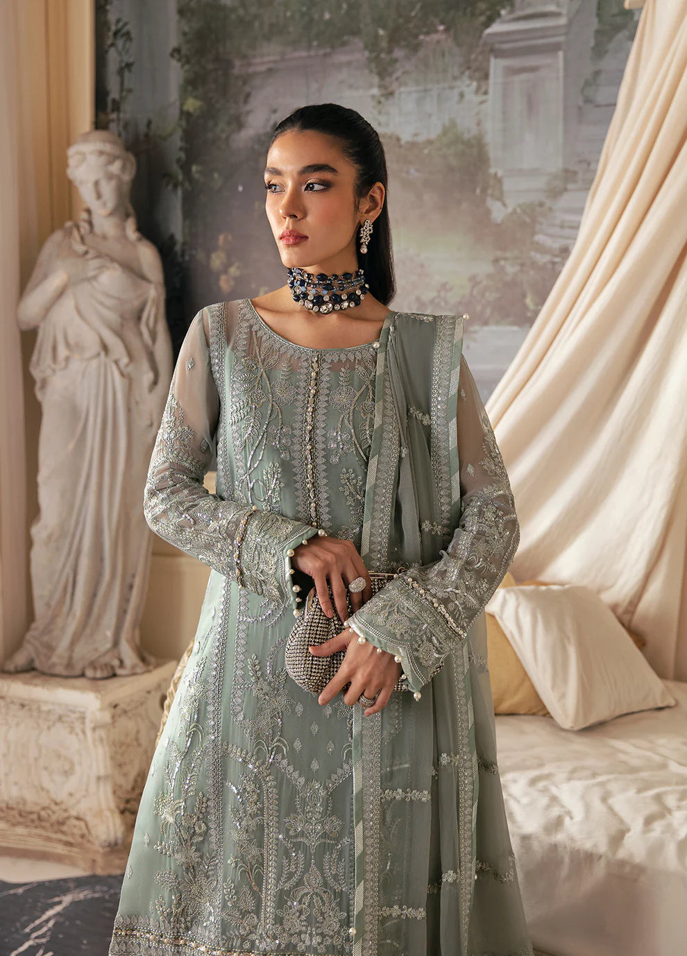 Model in Gulaal UK AMAYAH, sage green embroidered chiffon, '23 V2 Pakistani clothes UK collection.