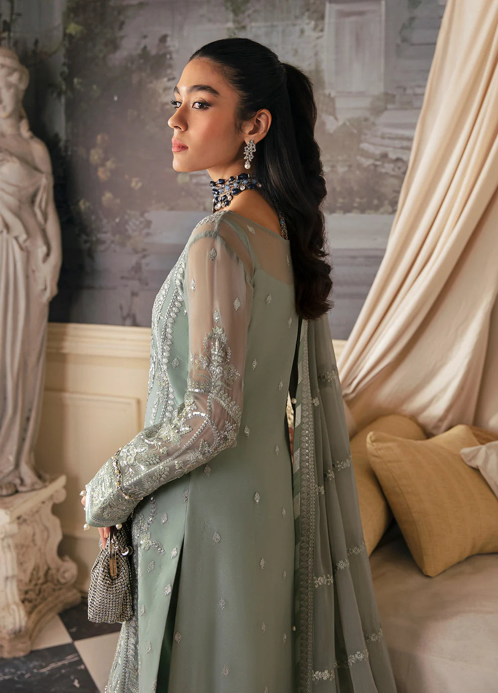 Model in Gulaal UK AMAYAH, sage green embroidered chiffon, '23 V2 Pakistani clothes UK collection.