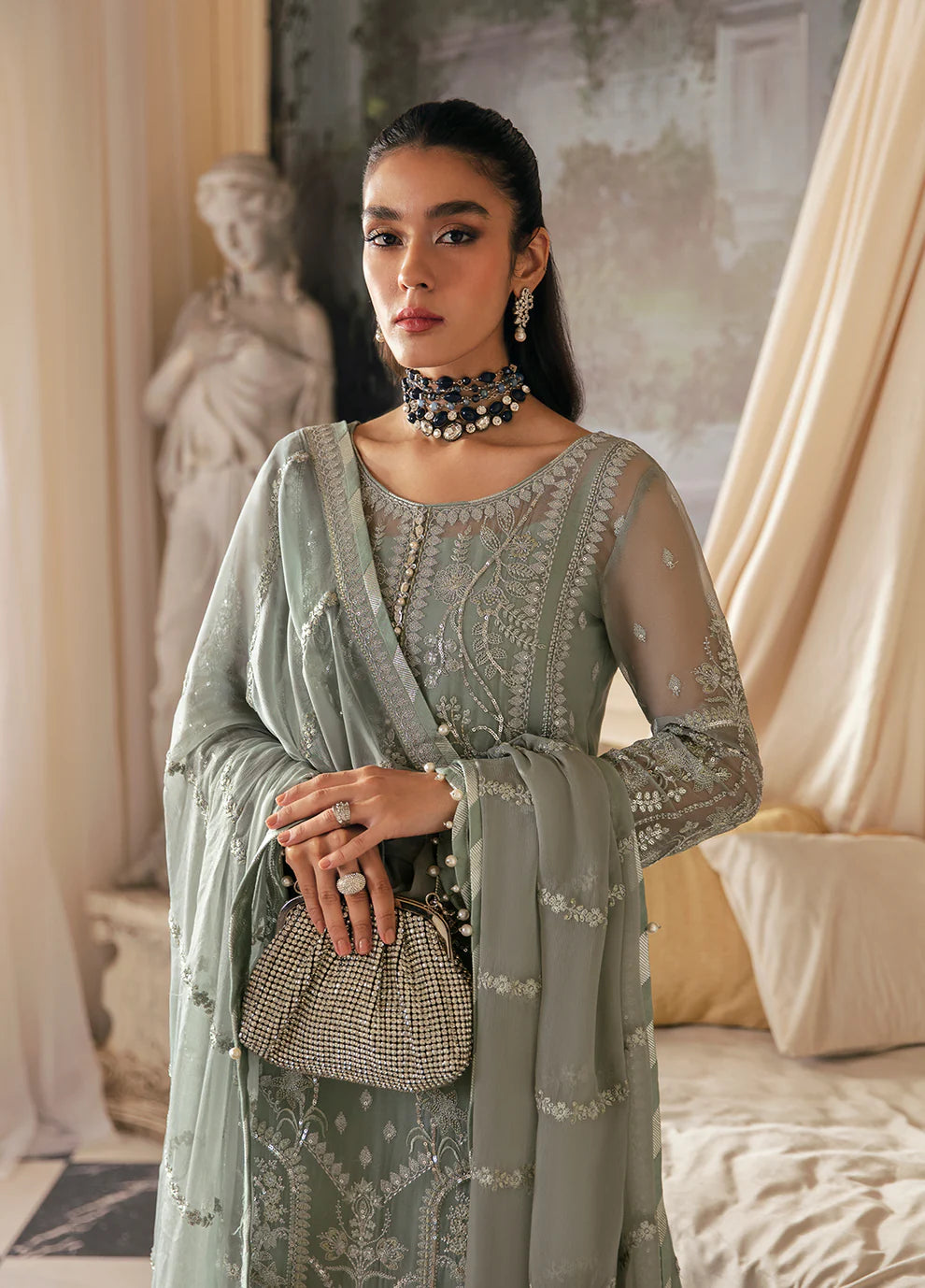 Model in Gulaal UK AMAYAH, sage green embroidered chiffon, '23 V2 Pakistani clothes UK collection.