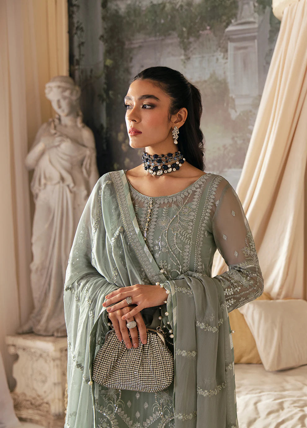 Model in Gulaal UK AMAYAH, sage green embroidered chiffon, '23 V2 Pakistani clothes UK collection.