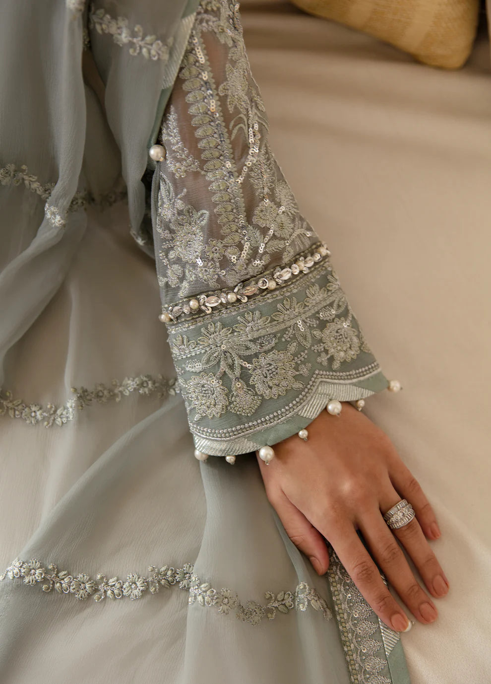 Model in Gulaal UK AMAYAH, sage green embroidered chiffon, '23 V2 Pakistani clothes UK collection.