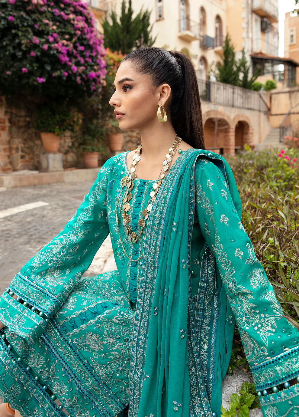 Elegant model in Gulaal's CIANA outfit, teal Pakistani attire, perfect for UK's ethnic wardrobe.