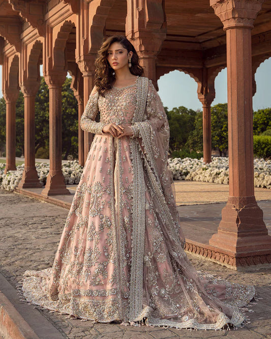 Model wearing dusty pink Aysana dress by Faiza Saqlain, Pakistani luxury pret online in UK for weddings and festive wear.