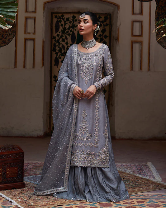 model wearing grey embroidered dress by Faiza Saqlain, Pakistani luxury pret available online in UK