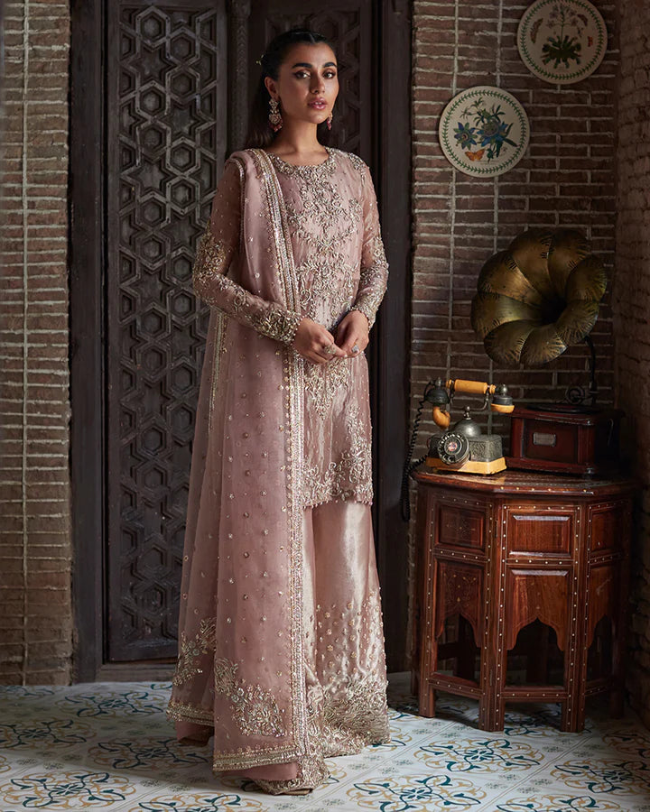 model wearing dusty pink embroidered dress by Faiza Saqlain, Pakistani luxury pret available online in UK