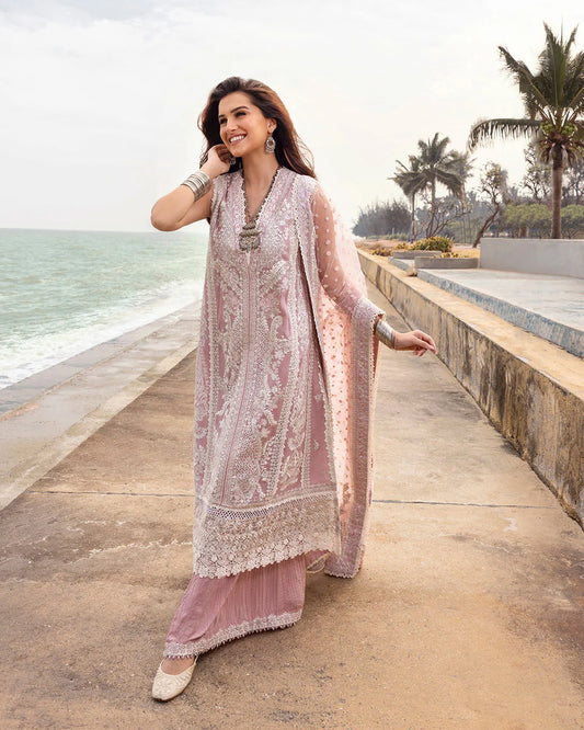 Model wearing blush pink Amaryllis dress from Faiza Saqlain Zinnia collection, Pakistani Luxury pret, Faiza Saqlain Pakistani clothes online in UK.