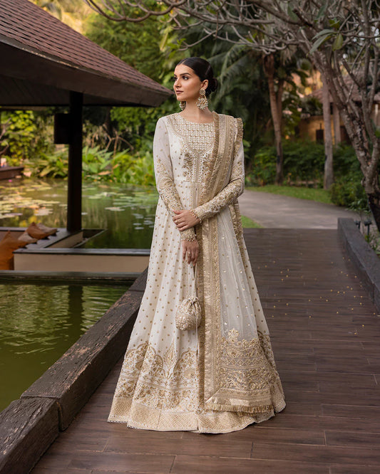 Model wearing ivory gold Lily dress from Faiza Saqlain Zinnia collection, Pakistani Luxury pret, Faiza Saqlain Pakistani clothes online in UK.
