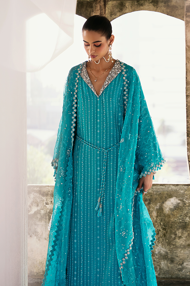 Model wearing NAIDA, back view, a Pakistani designer outfit by Suffuse, available online in the UK.