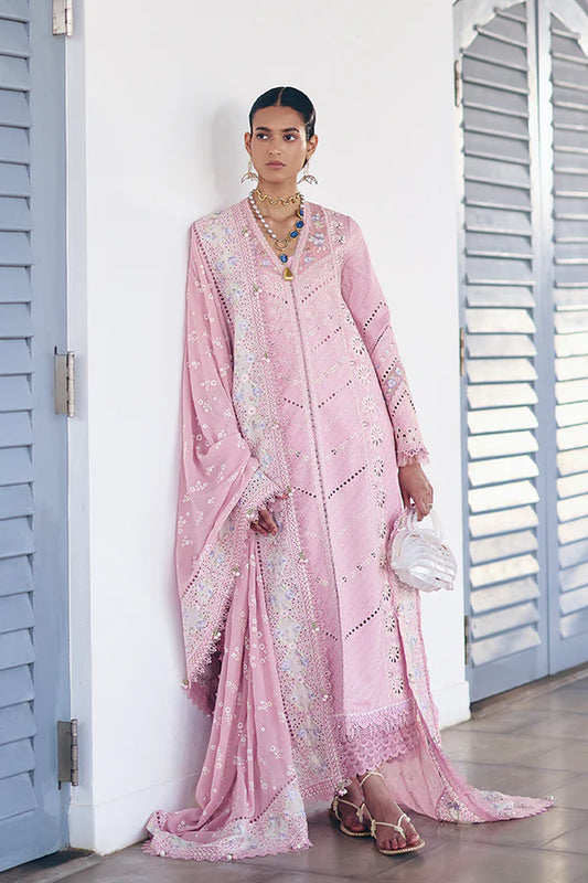 Model wearing pastel pink embroidered dress with intricate lace details from Suffuse Casual Pret 2025 Safar. Pakistani luxury pret in UK