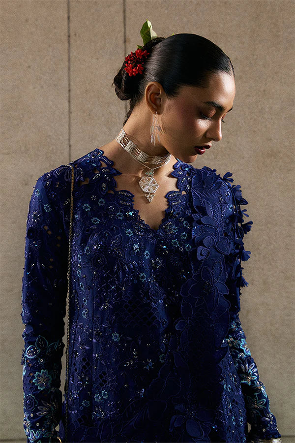 Model wearing indigo blue embellished ensemble from Suffuse Freyssa, Pakistani luxury pret, shop Pakistani clothes online in UK
