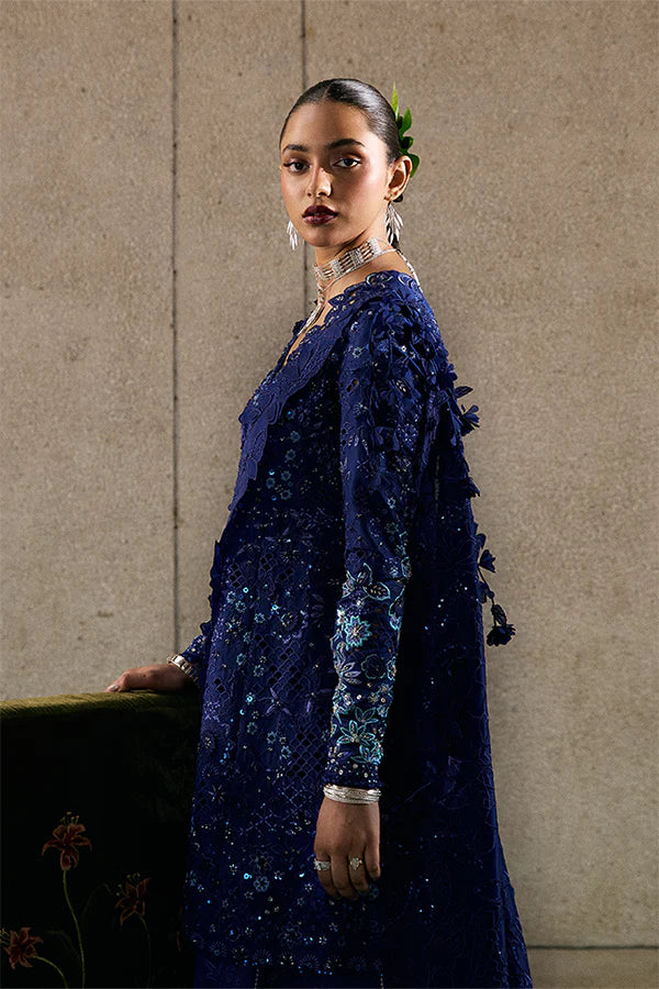 Model wearing indigo blue embellished ensemble from Suffuse Freyssa, Pakistani luxury pret, shop Pakistani clothes online in UK
