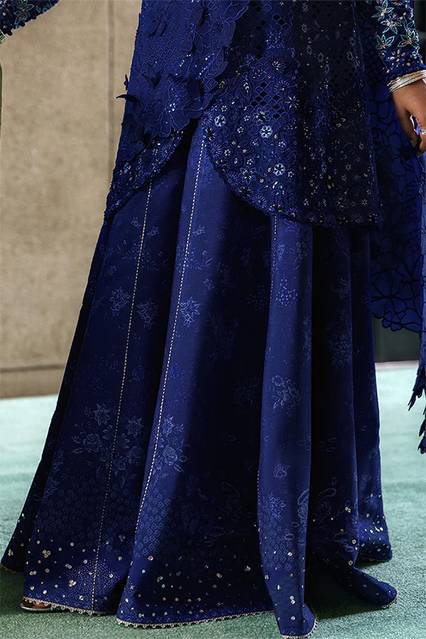 Model wearing indigo blue embellished ensemble from Suffuse Freyssa, Pakistani luxury pret, shop Pakistani clothes online in UK
