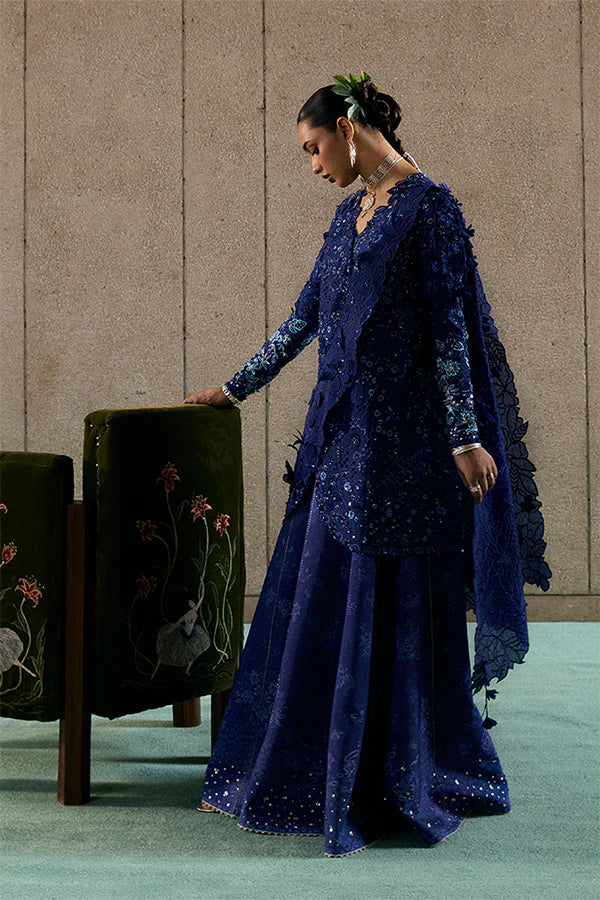 Model wearing indigo blue embellished ensemble from Suffuse Freyssa, Pakistani luxury pret, shop Pakistani clothes online in UK
