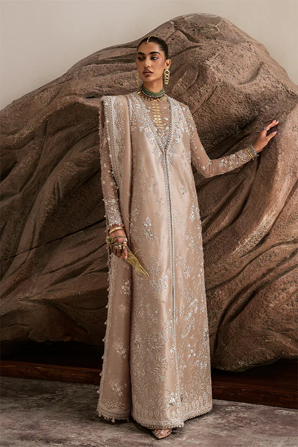 Model wearing beige embellished ensemble from Suffuse Ismira, Pakistani luxury pret, shop Pakistani clothes online in UK
