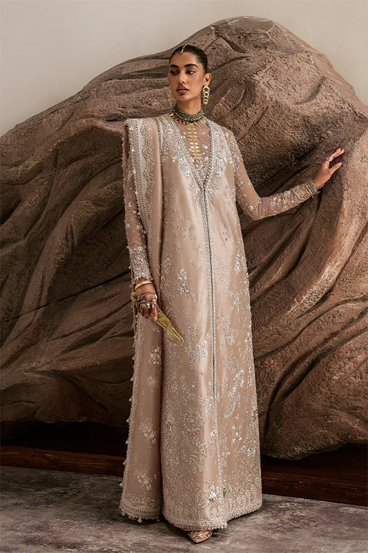 Model wearing beige embellished ensemble from Suffuse Ismira, Pakistani luxury pret, shop Pakistani clothes online in UK
