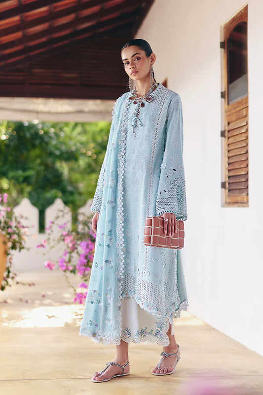 Model wearing pastel blue embroidered dress from Suffuse Casual Pret 2025 Zarina. Pakistani luxury pret and Pakistani clothes online in UK.