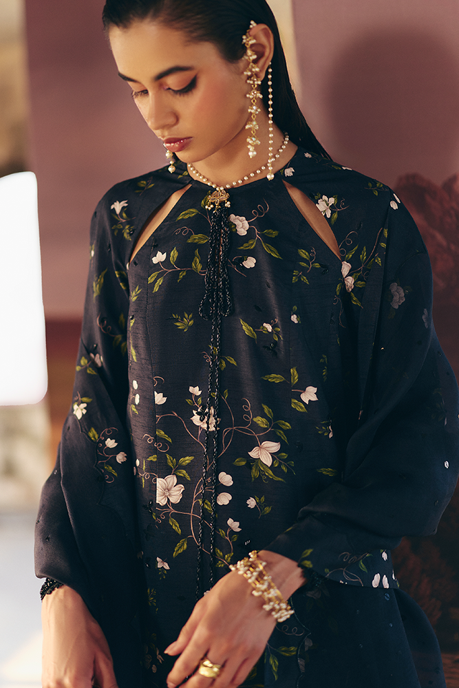 Model wearing ZEYARA, three-quarter view, a Pakistani designer outfit by Suffuse, available online in the UK.