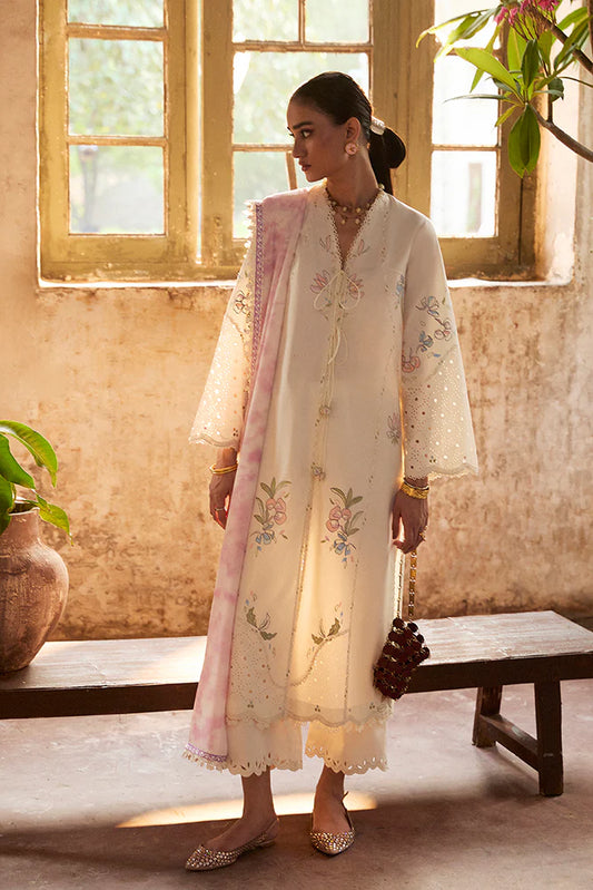 Model wearing Zeyra by Suffuse in ivory with pastel floral embroidery – graceful Pakistani luxury pret outfit in UK.