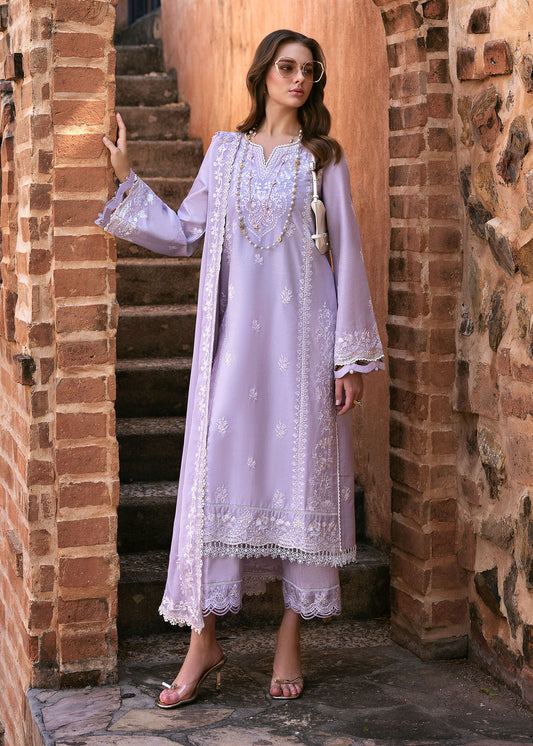 Model wearing Kanwal Malik Siena KM Basics '25 Zoe in soft lilac with delicate embroidery. Shop Pakistani luxury pret online in the UK.