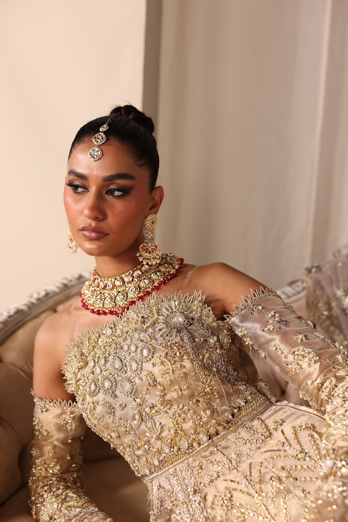 Model wearing champagne gold bridal gown Juni from Mysie By Tahira Wedding Edits '25, Pakistani luxury pret and clothes online in UK.
