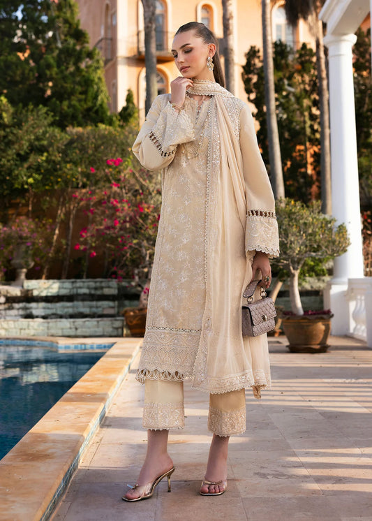 Model wearing Kanwal Malik Siena KM Basics '25 Sage in pastel beige with delicate embroidery. Shop Pakistani luxury pret online in the UK.