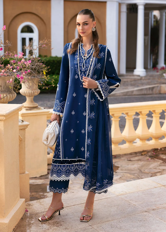 Model wearing Kanwal Malik Siena KM Basics '25 Zuha in navy blue with intricate embroidery. Shop Pakistani luxury pret online in the UK.