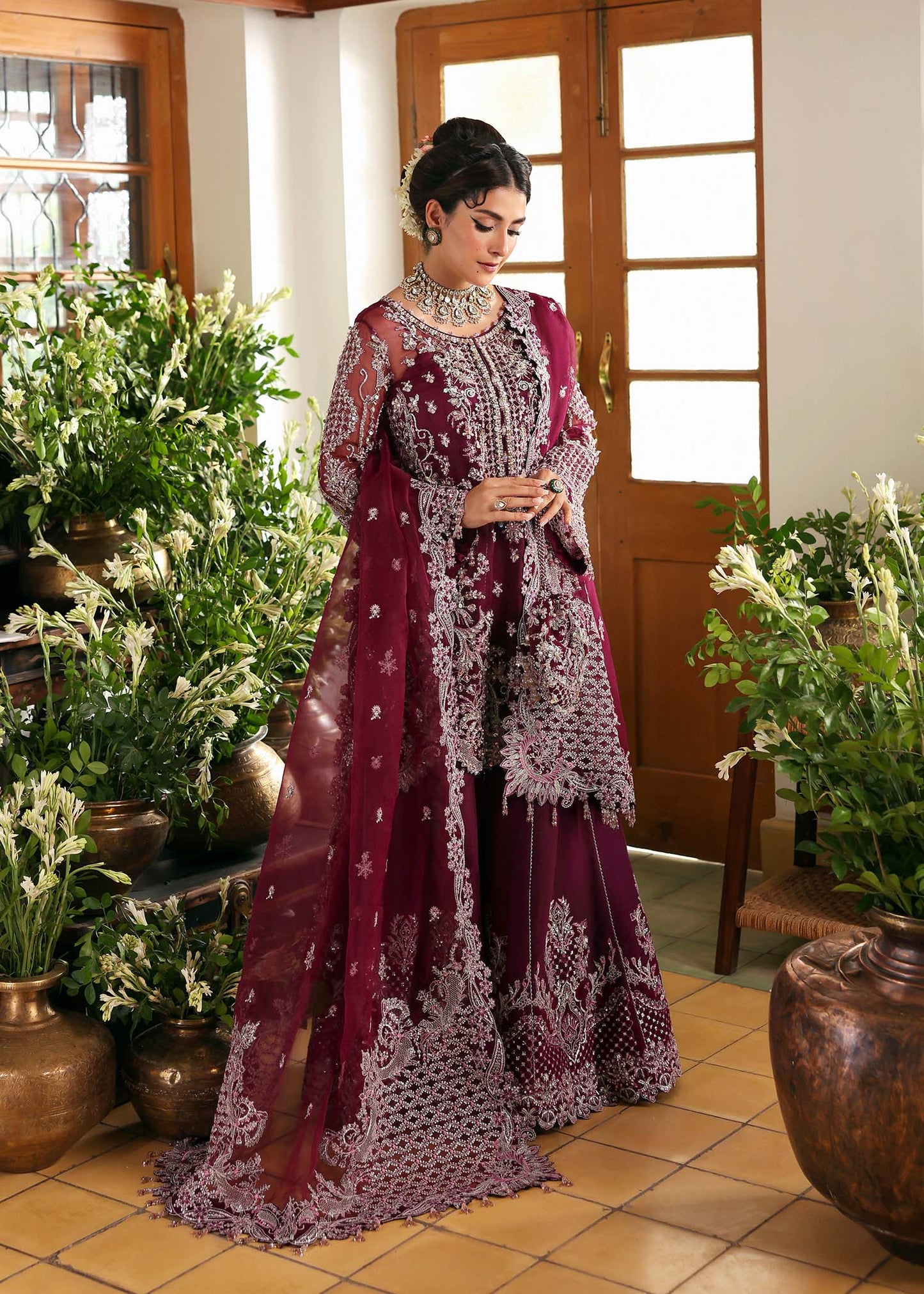 Model wearing Safiya by Kanwal Malik in deep maroon embroidered ensemble – Pakistani luxury pret outfit available online in UK.