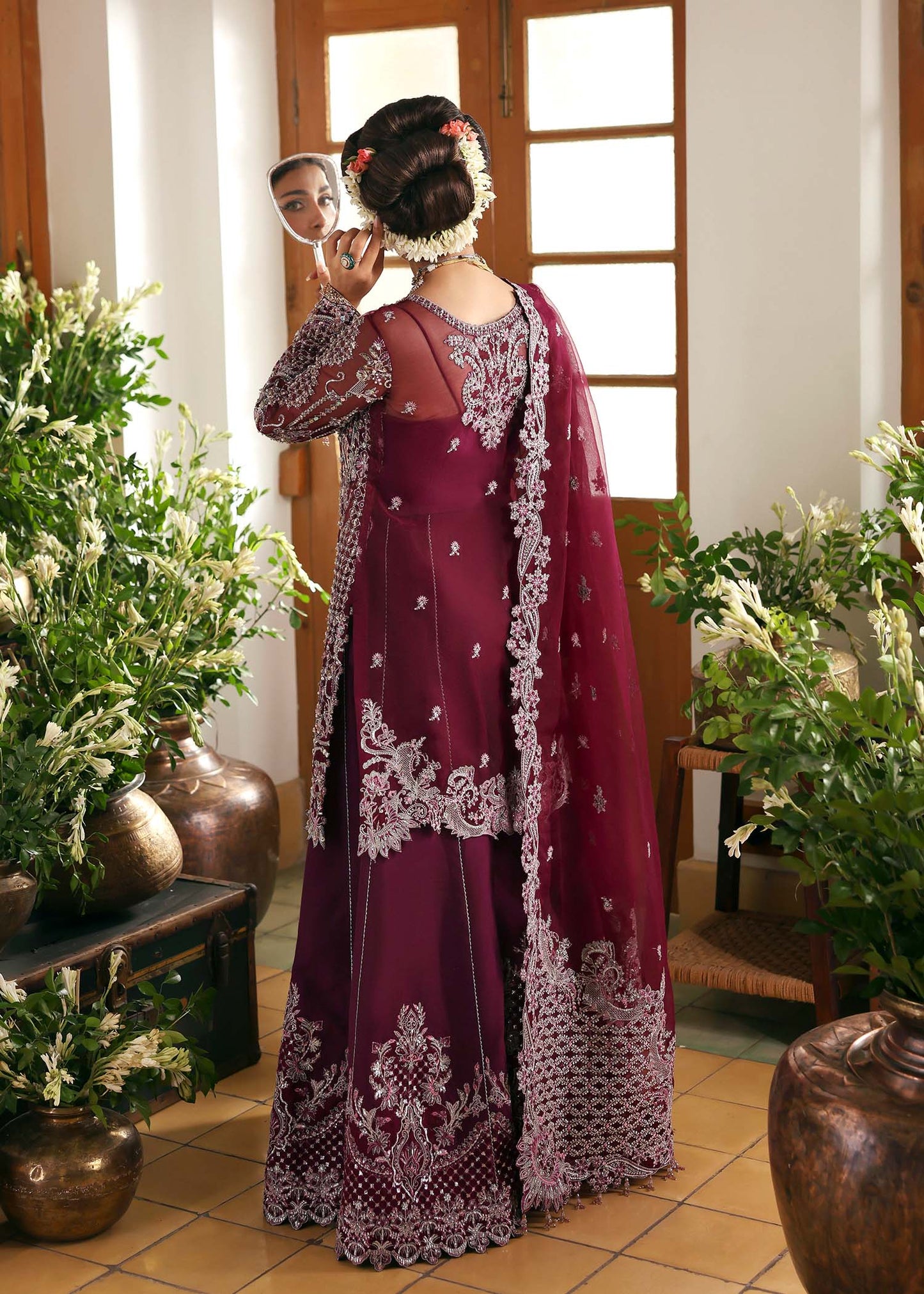 Model wearing Safiya by Kanwal Malik in deep maroon embroidered ensemble – Pakistani luxury pret outfit available online in UK.