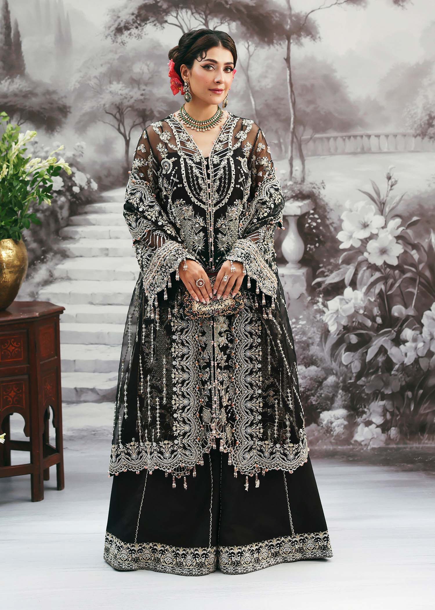 Model wearing Huriya by Kanwal Malik in black heavily embroidered outfit – Pakistani luxury pret available online in UK for festive wear.