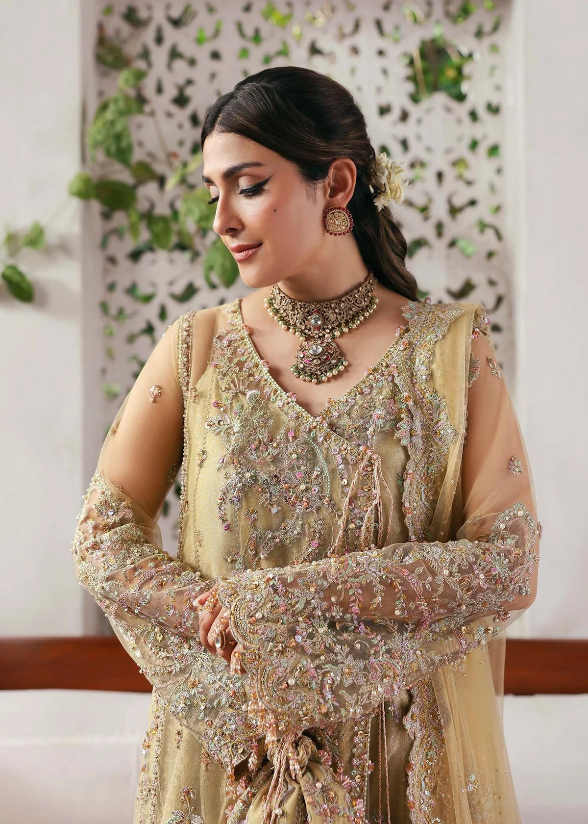 Model wearing Rukhsaar by Kanwal Malik in soft gold embroidered ensemble – Pakistani luxury pret dress available online in UK for festive wear.
