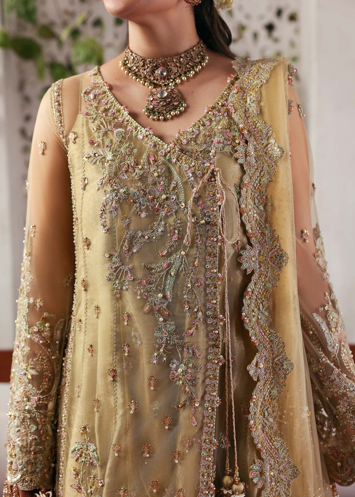 Model wearing Rukhsaar by Kanwal Malik in soft gold embroidered ensemble – Pakistani luxury pret dress available online in UK for festive wear.
