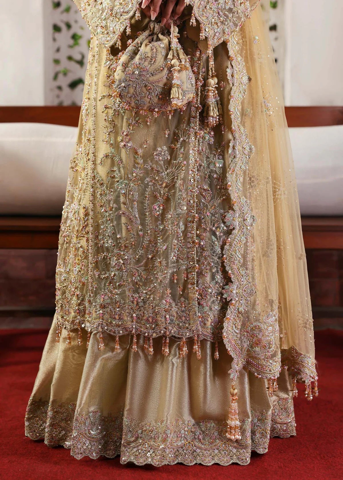 Model wearing Rukhsaar by Kanwal Malik in soft gold embroidered ensemble – Pakistani luxury pret dress available online in UK for festive wear.
