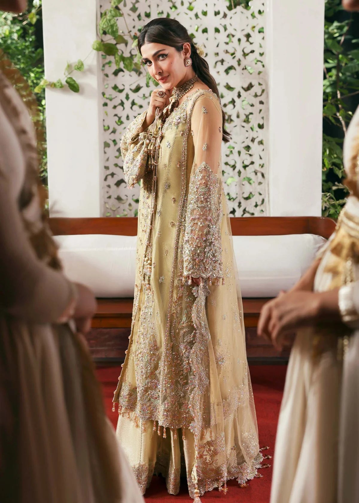 Model wearing Rukhsaar by Kanwal Malik in soft gold embroidered ensemble – Pakistani luxury pret dress available online in UK for festive wear.
