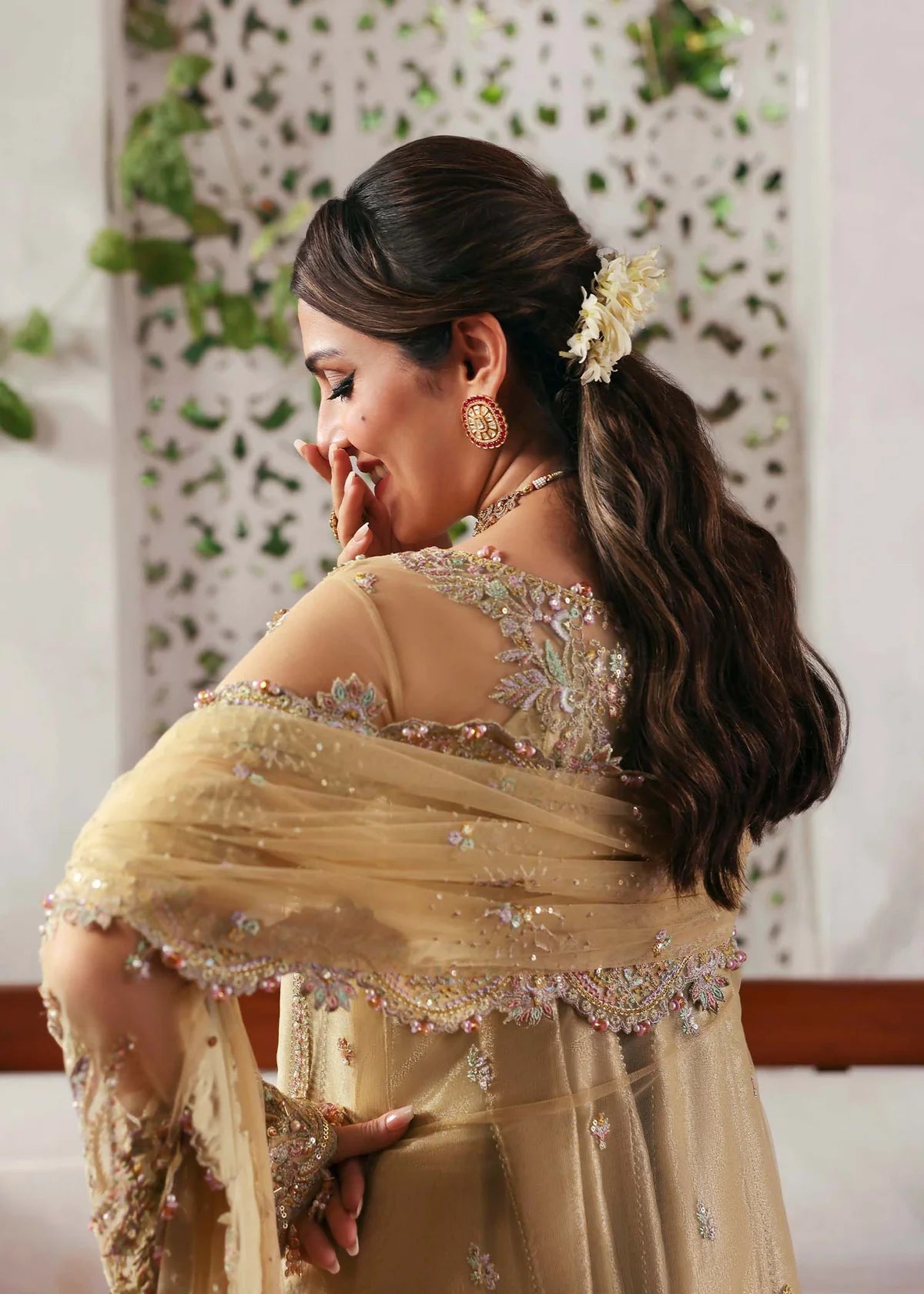Model wearing Rukhsaar by Kanwal Malik in soft gold embroidered ensemble – Pakistani luxury pret dress available online in UK for festive wear.

