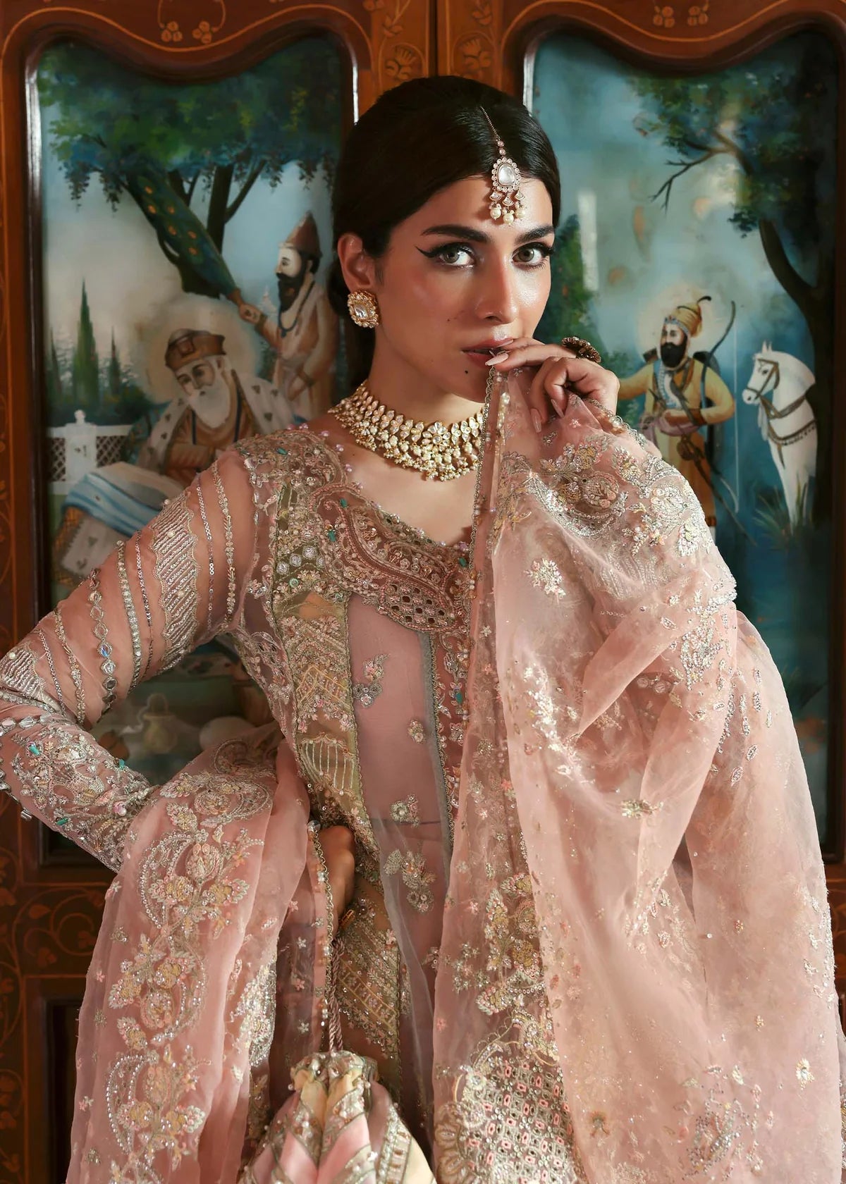Model wearing Mehar by Kanwal Malik in soft peach pink embroidered ensemble – Pakistani luxury pret dress available online in UK for festive wear.
