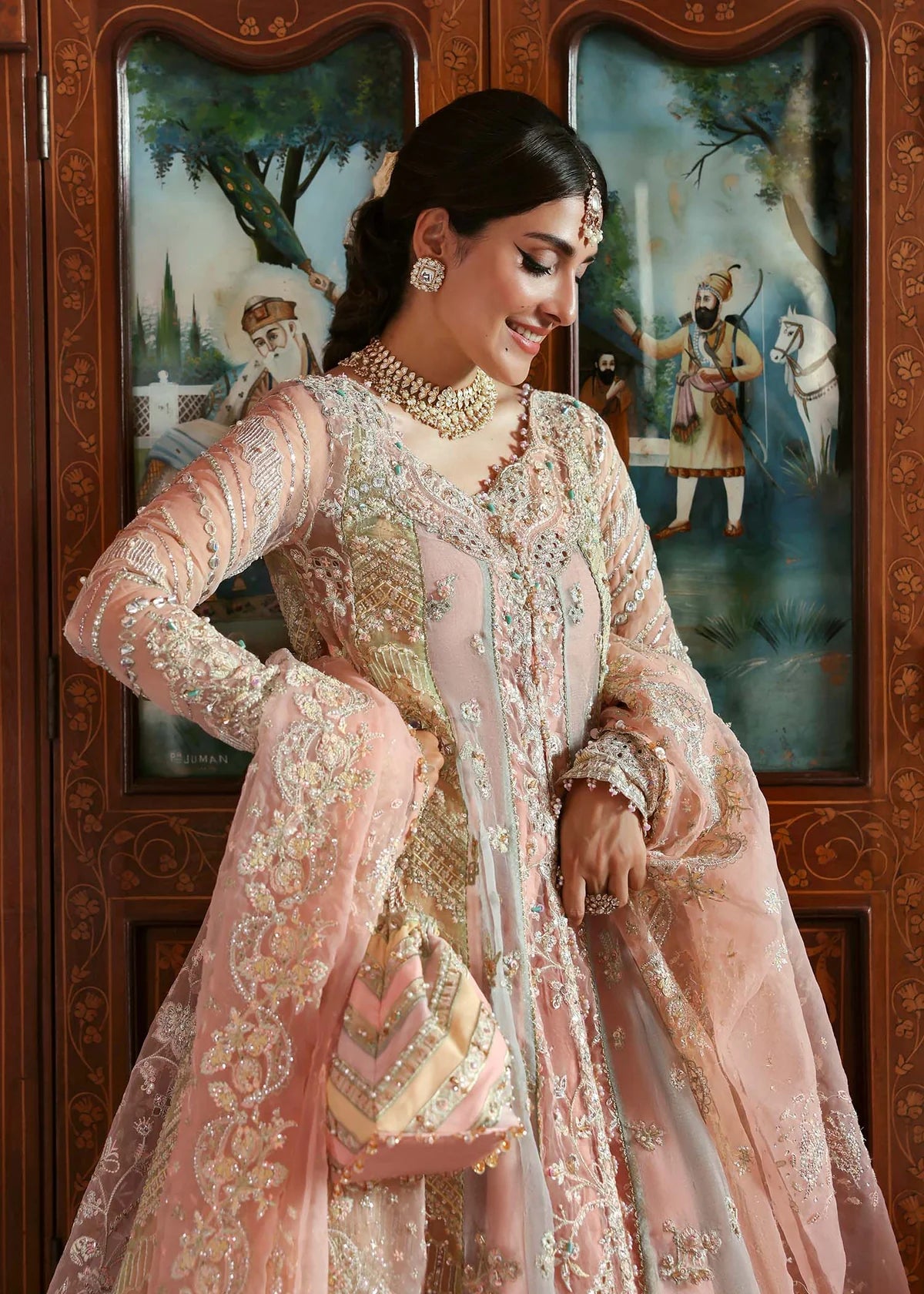 Model wearing Mehar by Kanwal Malik in soft peach pink embroidered ensemble – Pakistani luxury pret dress available online in UK for festive wear.
