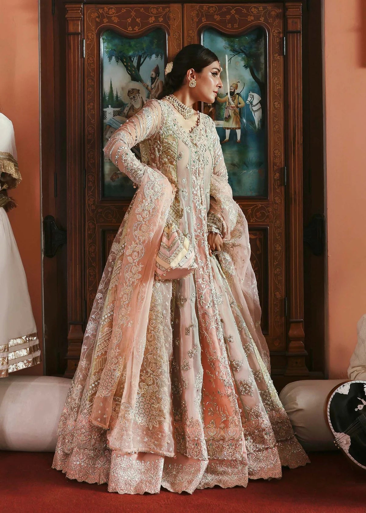 Model wearing Mehar by Kanwal Malik in soft peach pink embroidered ensemble – Pakistani luxury pret dress available online in UK for festive wear.
