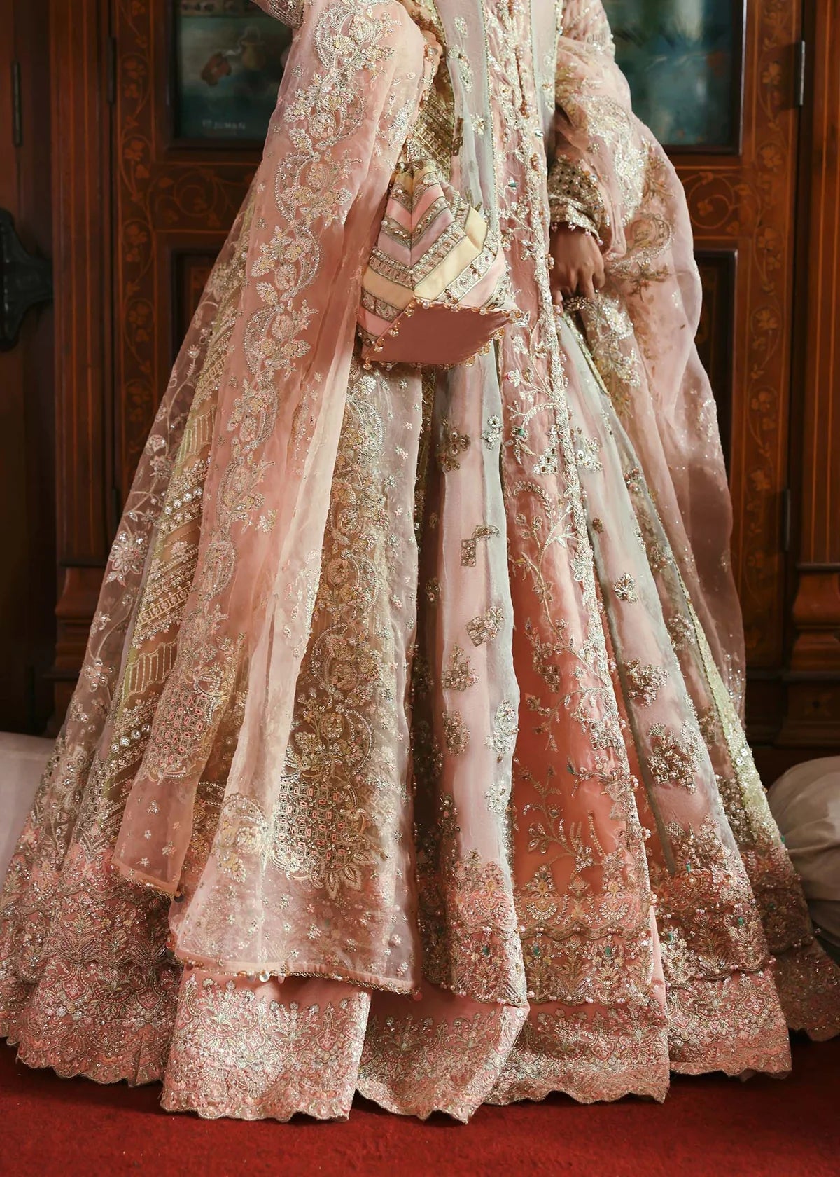 Model wearing Mehar by Kanwal Malik in soft peach pink embroidered ensemble – Pakistani luxury pret dress available online in UK for festive wear.
