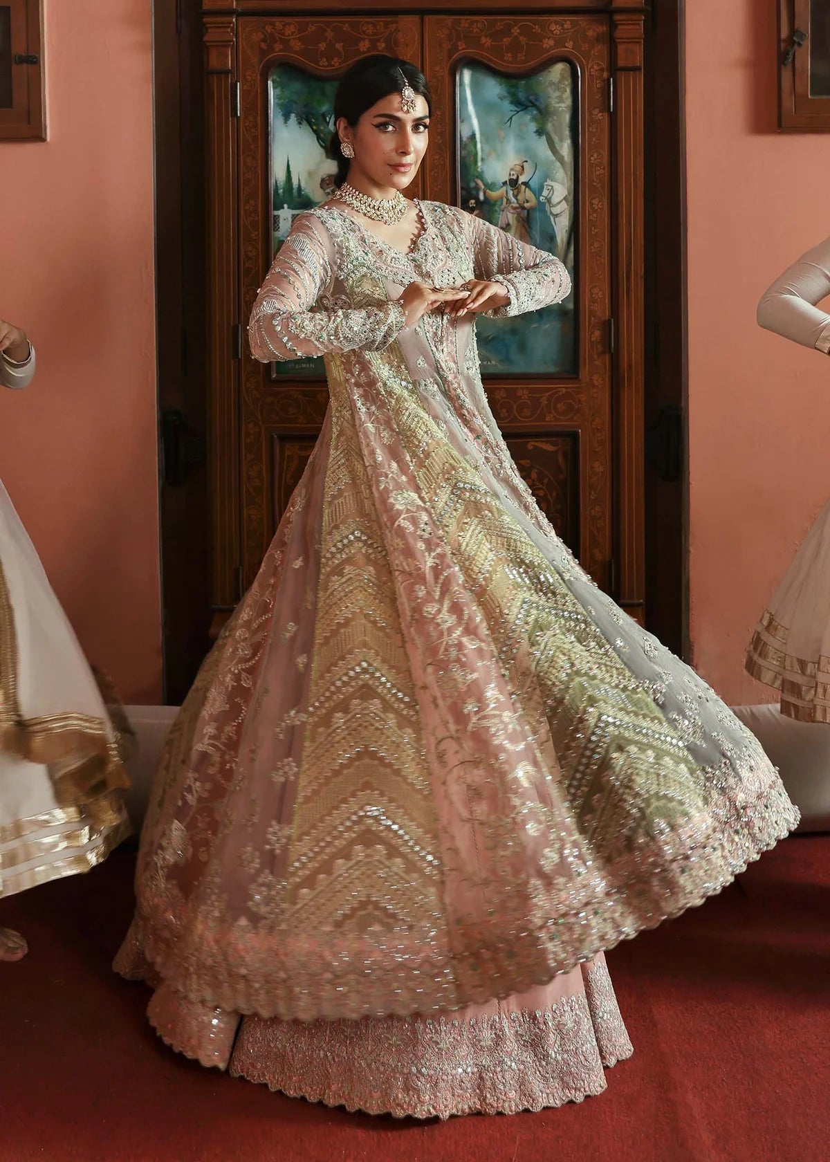 Model wearing Mehar by Kanwal Malik in soft peach pink embroidered ensemble – Pakistani luxury pret dress available online in UK for festive wear.
