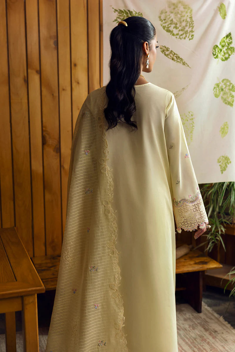 Model wearing pale yellow DC-04 Keva from Qalamkar Qlinekari Lawn '25, Pakistani Luxury pret, Pakistani clothes online in UK.
