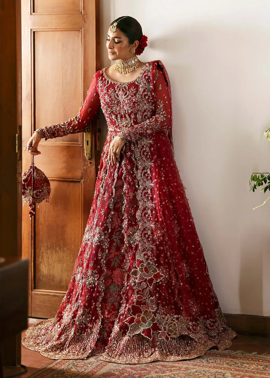 Model wearing Gulrukh by Kanwal Malik in deep red bridal ensemble with heavy embroidery – Pakistani luxury pret available online in UK.
