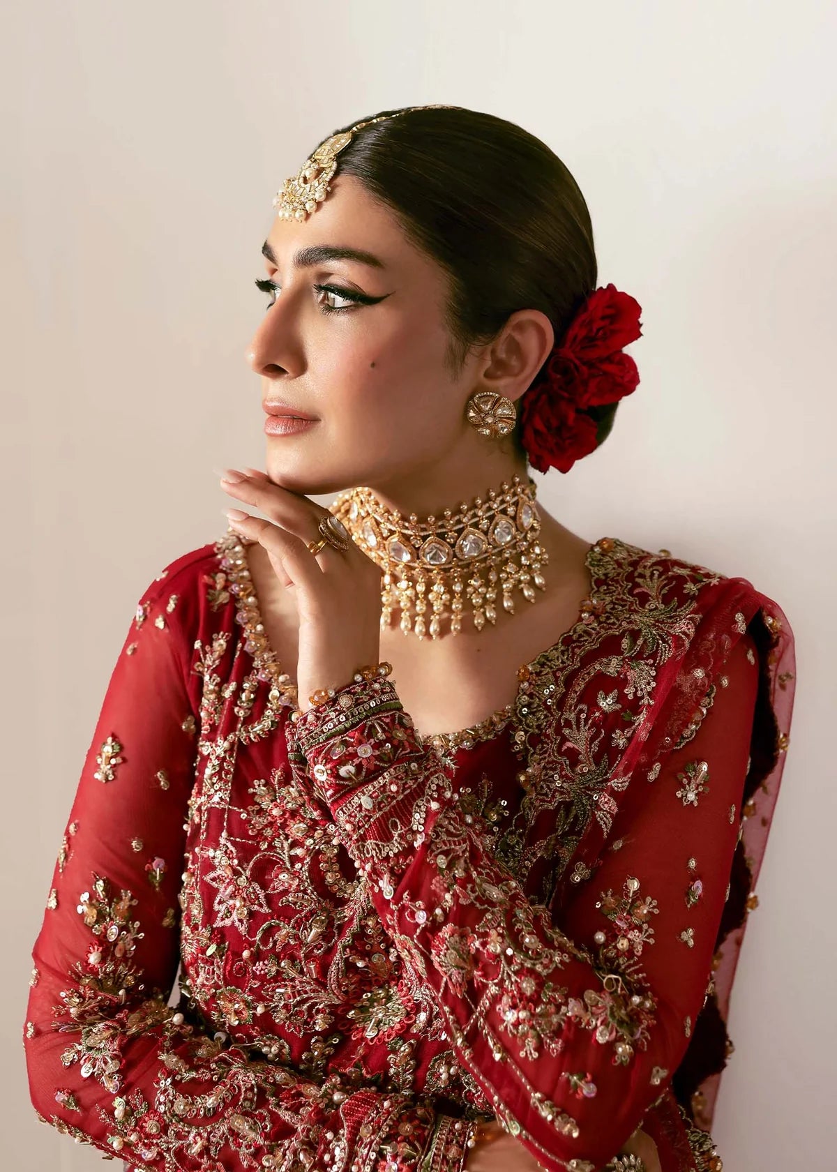 Model wearing Gulrukh by Kanwal Malik in deep red bridal ensemble with heavy embroidery – Pakistani luxury pret available online in UK.
