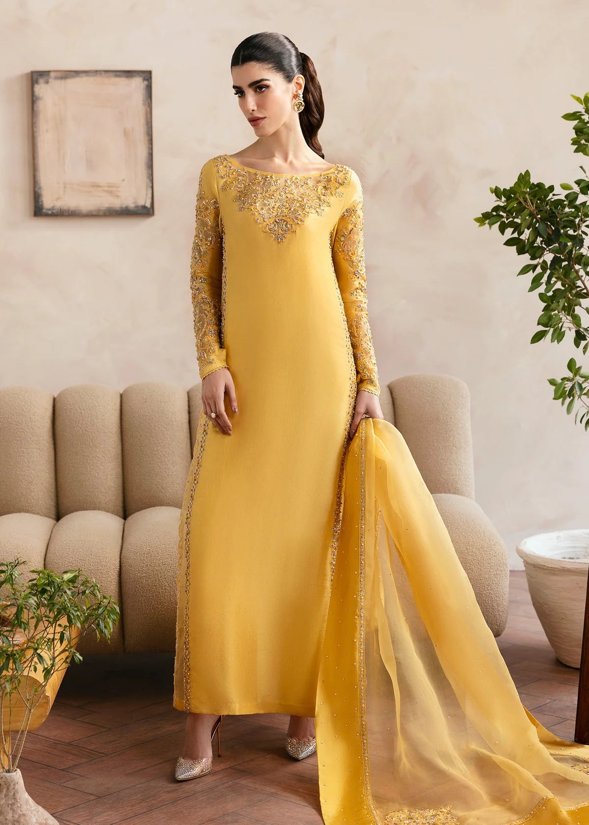 Model wearing Kanwal Malik Saesha yellow luxury pret dress. Shop Pakistani clothes online in the UK for elegant occasion wear.